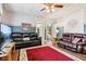 Spacious living room with classic decor, hardwood floors, and access to other rooms at 409 N Sycamore St, Martinsville, IN 46151