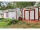 View of two sheds, one with red trim, offering ample outdoor storage space and functionality at 409 N Sycamore St, Martinsville, IN 46151