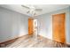 Spacious bedroom with hardwood floors and ample natural light, offering a comfortable retreat at 4210 Main St, Anderson, IN 46013