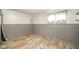 Bedroom features wood floors, wainscoting, natural light, and neutral paint at 4210 Main St, Anderson, IN 46013