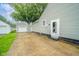 Long cracked concrete driveway leading to a detached garage and backyard entrance at 4210 Main St, Anderson, IN 46013