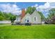 Charming home with a classic design, landscaped lawn, and inviting front porch at 4210 Main St, Anderson, IN 46013