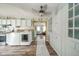 Bright kitchen boasts a ceiling fan, open access to other living spaces, and modern appliances at 4210 Main St, Anderson, IN 46013