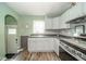 Well-lit kitchen with modern appliances, ample cabinet space, and a view to the outdoors at 4210 Main St, Anderson, IN 46013