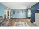 Bright living room with hardwood floors, open archways, and stylish furniture at 4210 Main St, Anderson, IN 46013