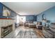 Comfortable living room featuring a fireplace, soft lighting, and a spacious seating area at 4210 Main St, Anderson, IN 46013