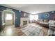Cozy living room with a decorative fireplace, plush sofa, and stylish decor at 4210 Main St, Anderson, IN 46013