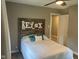 Relaxing bedroom with a large headboard, comfortable bed, and hardwood floors at 4445 Kingsley Dr, Indianapolis, IN 46205
