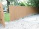 New wooden fence offering privacy and security to the backyard, enhancing the outdoor living space at 4445 Kingsley Dr, Indianapolis, IN 46205