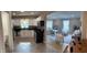Open concept kitchen and living room with stainless steel appliances and cozy furniture at 4445 Kingsley Dr, Indianapolis, IN 46205