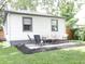 Cozy patio area featuring comfortable outdoor seating, ideal for relaxing and enjoying the backyard views at 4445 Kingsley Dr, Indianapolis, IN 46205