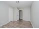 Spacious bedroom featuring new flooring, a fresh coat of light-grey paint, walk in closet at 4514 Priscilla Ave, Indianapolis, IN 46226