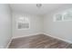 Bright bedroom featuring new flooring, a fresh coat of light-grey paint and abundant natural light at 4514 Priscilla Ave, Indianapolis, IN 46226