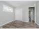 Large bedroom with generous closet space, new flooring, light-grey paint, access to shared hallway at 4514 Priscilla Ave, Indianapolis, IN 46226