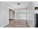 Bright dining area featuring wood-look flooring and a large window at 4514 Priscilla Ave, Indianapolis, IN 46226