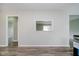 Freshly painted walls provide sight line into the adjacent space and new floors at 4514 Priscilla Ave, Indianapolis, IN 46226