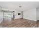 Open-concept living space featuring wood-look floors and freshly painted walls at 4514 Priscilla Ave, Indianapolis, IN 46226