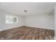 Bright living room with wood-look flooring, neutral paint, and ample natural light at 4514 Priscilla Ave, Indianapolis, IN 46226