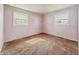 Empty bedroom featuring abundant natural light through bright, double windows at 4648 Brookville Rd, Indianapolis, IN 46201