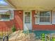 Charming front porch with brick accents, white trim, and vintage railing at 4648 Brookville Rd, Indianapolis, IN 46201