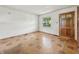 Bright living room with clean, white paneled walls and a classic window with a view at 4648 Brookville Rd, Indianapolis, IN 46201