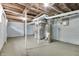 Spacious unfinished basement with visible ductwork, painted walls, concrete floor, and existing mechanicals at 517 N Alton Ave, Indianapolis, IN 46222