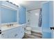 Bright bathroom with white vanity, toilet, and shower/tub combination featuring modern fixtures at 517 N Alton Ave, Indianapolis, IN 46222