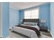 Staged bedroom offers a comforting retreat with modern furniture and decor at 517 N Alton Ave, Indianapolis, IN 46222