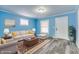 Staged living room featuring a sofa, chairs, and decor that highlight the home's charm at 517 N Alton Ave, Indianapolis, IN 46222