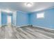 Spacious living room showing new floors, fresh paint, and well-lit with recessed lighting at 517 N Alton Ave, Indianapolis, IN 46222