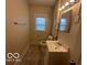 Neutral bathroom with a single sink vanity and tiled flooring at 521 N Alton Ave, Indianapolis, IN 46222