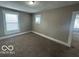 Cozy bedroom with neutral walls and plush carpet at 521 N Alton Ave, Indianapolis, IN 46222
