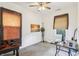 Bedroom featuring carpet, fan, closet, and large window at 524 S Arlington Ave, Indianapolis, IN 46219