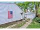 House exterior with a garage, driveway, and American flag at 524 S Arlington Ave, Indianapolis, IN 46219