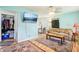 Cozy living room with modern decor, neutral rug, and a flat-screen TV at 524 S Arlington Ave, Indianapolis, IN 46219