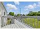 The back deck overlooks the yard with a wood fence at 5503 Antoneli Ln, Indianapolis, IN 46237