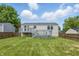 Large fenced backyard featuring a spacious deck, perfect for outdoor entertaining and relaxation at 5503 Antoneli Ln, Indianapolis, IN 46237