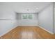 Spacious basement with a bright window and painted paneling on the lower wall at 5503 Antoneli Ln, Indianapolis, IN 46237