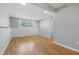 The finished basement area has recessed lighting and wood-look floors at 5503 Antoneli Ln, Indianapolis, IN 46237