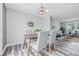 Open-concept dining area with stylish table and chairs, seamlessly connected to the living space at 5503 Antoneli Ln, Indianapolis, IN 46237