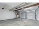 Unfinished garage with concrete floors and exposed ceiling at 5503 Antoneli Ln, Indianapolis, IN 46237