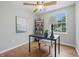 Bright office with natural light, hardwood floors, and a minimal furniture set at 5503 Antoneli Ln, Indianapolis, IN 46237