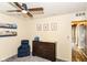 Inviting bedroom with a cozy chair and dresser, along with cheerful decor and shelving, perfect for a space at 5775 Bluff View Ln, Whitestown, IN 46075
