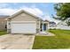 Charming single-story home with a two-car garage, stone accents, and a well-maintained lawn at 5775 Bluff View Ln, Whitestown, IN 46075