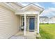 Inviting front porch with stone accents and a stylish blue front door at 5775 Bluff View Ln, Whitestown, IN 46075