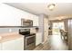 Well-equipped kitchen featuring stainless steel appliances and access to the dining area at 5775 Bluff View Ln, Whitestown, IN 46075