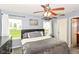 Bright main bedroom with a ceiling fan and peaceful decor at 5775 Bluff View Ln, Whitestown, IN 46075
