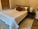 Cozy bedroom with a comfortable bed, a soft rug, and warm natural light at 5786 N Delaware St, Indianapolis, IN 46220