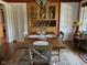Inviting dining room featuring a wooden table set for four, built in cabinets, and ample natural light at 5786 N Delaware St, Indianapolis, IN 46220