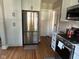 Modern kitchen with stainless steel refrigerator and gas range at 5786 N Delaware St, Indianapolis, IN 46220